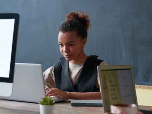A young lady sat at a computer